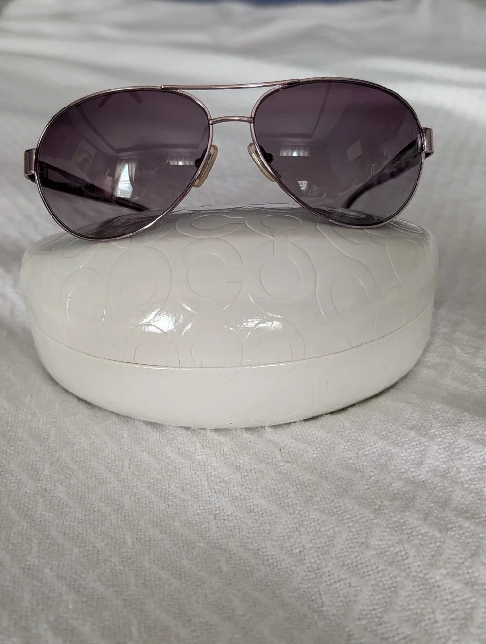 Coach Women's purple aviator sunglasses with butterfly detail